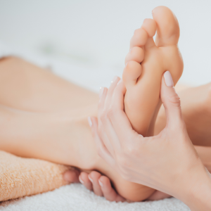 feet receiving reflexology treatment